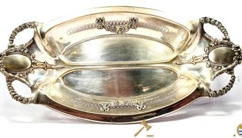 Centro de mesa Argentor,cuerpo oval,borde calado,con cartela y guirnaldas