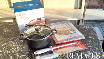 olla con tapa de vidrio, cuchilla con chaira y  mantel
