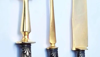 Tres piezas para tortas virolas de plata y cabo marfil